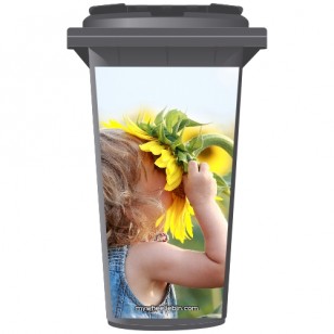 Young Girl Sniffing A Sunflower Wheelie Bin Sticker Panel